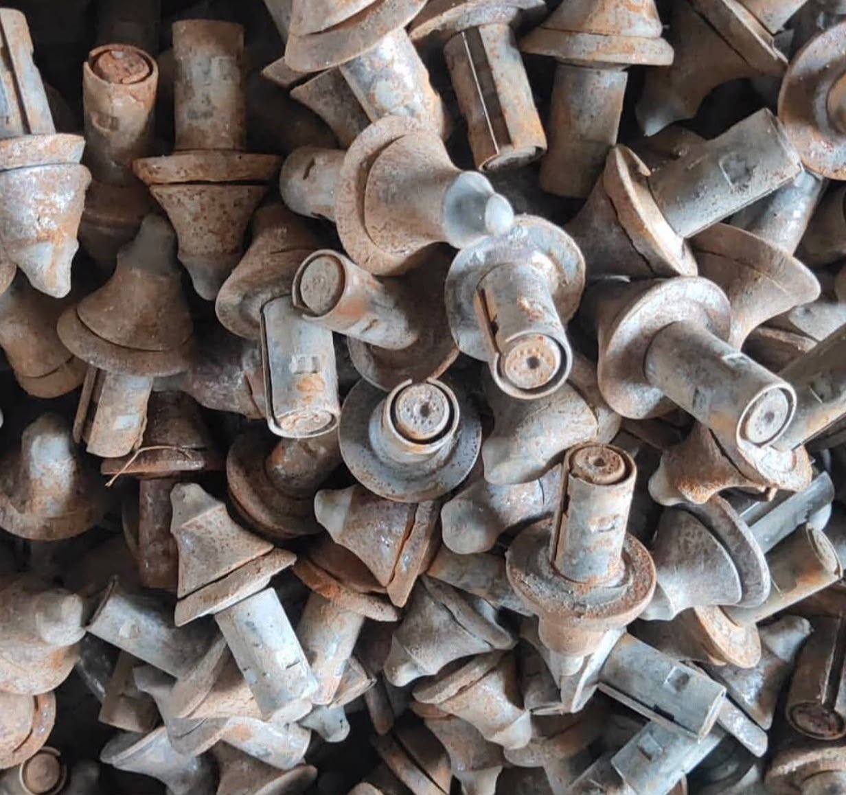 Heap of cast metal components awaiting assessment for salvage